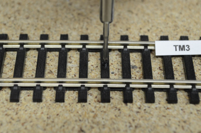 Repair sealant for covering holes in track sleepers, black, 15g