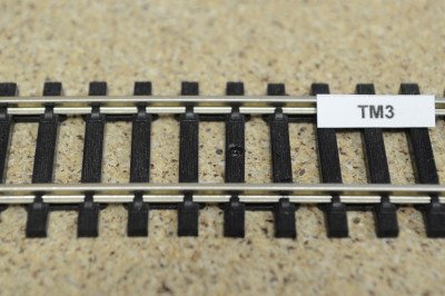 Repair sealant for covering holes in track sleepers, black, 15g